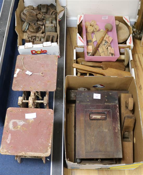 A set of Victorian heavy duty scales with three heavy iron block weights,wooden butter pats, moulds, presses, a cash till etc.